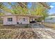 Charming single-story home featuring a carport and well-maintained landscaping at 164 Nw Lincoln N Cir, St Petersburg, FL 33702