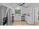 Modern kitchen with stainless steel appliances, white cabinetry, and sleek countertops at 164 Nw Lincoln N Cir, St Petersburg, FL 33702