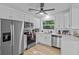 Well-appointed kitchen featuring stainless steel appliances, quartz countertops, and ample storage space at 164 Nw Lincoln N Cir, St Petersburg, FL 33702