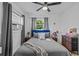 Inviting bedroom featuring a plush bed with blue headboard, comfortable bedding, and stylish decor at 164 Nw Lincoln N Cir, St Petersburg, FL 33702