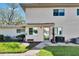 Close up exterior featuring well-maintained landscaping, exterior wall, door, and windows at 1832 Bough Ave # 3, Clearwater, FL 33760