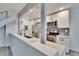 Charming kitchen featuring white cabinetry, granite countertops, and stainless-steel appliances at 1832 Bough Ave # 3, Clearwater, FL 33760