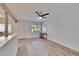 Cozy living room featuring modern flooring, bright paint and contemporary ceiling fan at 1832 Bough Ave # 3, Clearwater, FL 33760