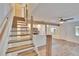 A staircase adjacent to the living room and kitchen provides access to the upper level at 1832 Bough Ave # 3, Clearwater, FL 33760