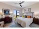 Cozy bedroom with vibrant art, city view, and comfortable bed at 199 Dali Blvd # 704, St Petersburg, FL 33701