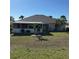 Spacious backyard showcasing mature landscaping and a screened lanai at 2021 E Del Webb Blvd, Sun City Center, FL 33573
