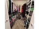 Walk-in closet features wire shelving to maximize storage at 2021 E Del Webb Blvd, Sun City Center, FL 33573