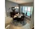 Dining room featuring a window with shutters, and a modern chandelier at 2021 E Del Webb Blvd, Sun City Center, FL 33573