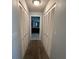 Hallway with closet on each side that leads to the bathroom at 2021 E Del Webb Blvd, Sun City Center, FL 33573