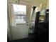 Kitchenette features a door to exterior, and a refrigerator at 2021 E Del Webb Blvd, Sun City Center, FL 33573