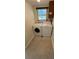 A quaint laundry room with washer and dryer units under a window at 2170 Americus N Blvd # 22, Clearwater, FL 33763