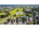 Gorgeous aerial shot of community golf course with scenic pond and the clubhouse in the distance at 23523 Gracewood Cir, Land O Lakes, FL 34639