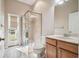 Bathroom featuring tiled shower, modern fixtures, and an exterior door for easy access at 23523 Gracewood Cir, Land O Lakes, FL 34639