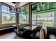 Cozy dining area with booth seating, large windows overlooking the golf course and lake at 23523 Gracewood Cir, Land O Lakes, FL 34639