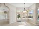 Dining area with views of the pool with adjacent outdoor covered area at 23523 Gracewood Cir, Land O Lakes, FL 34639