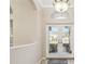 Bright foyer with a high ceiling, decorative chandelier, and a tiled floor leads to the rest of the home at 23523 Gracewood Cir, Land O Lakes, FL 34639