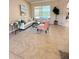 Bright living room showcasing tile floors, neutral walls, stylish furniture, and lots of light at 23523 Gracewood Cir, Land O Lakes, FL 34639