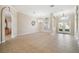 Open living room with tile flooring, arched doorways, and elegant lighting creates a seamless flow for entertaining at 23523 Gracewood Cir, Land O Lakes, FL 34639