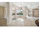 Open living area with tile floors and direct access to the screened pool and outdoor living space at 23523 Gracewood Cir, Land O Lakes, FL 34639