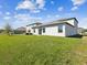 Spacious backyard with lush green grass, great for outdoor activities at 248 Argyll Dr, Spring Hill, FL 34609