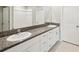 Bathroom featuring double sinks, granite countertops and tiled floors at 248 Argyll Dr, Spring Hill, FL 34609