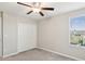 Bright bedroom featuring a closet, carpet and a window overlooking the playground at 248 Argyll Dr, Spring Hill, FL 34609