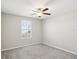 Bedroom features a ceiling fan, neutral walls, plush carpet, and a window with blinds at 248 Argyll Dr, Spring Hill, FL 34609