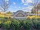 Stone community sign amidst lush green landscaping at 248 Argyll Dr, Spring Hill, FL 34609