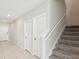 Bright entryway featuring tile floors and a staircase leading to the second level at 248 Argyll Dr, Spring Hill, FL 34609