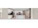 Modern kitchen with white cabinets, stainless steel appliances, granite countertops, and a kitchen island at 248 Argyll Dr, Spring Hill, FL 34609