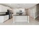 Bright kitchen featuring stainless steel appliances, central island, and tile flooring at 248 Argyll Dr, Spring Hill, FL 34609