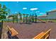 Community playground with slides, climbing structures, and seating areas at 248 Argyll Dr, Spring Hill, FL 34609