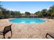 A large, inviting pool is surrounded by lounge chairs, with a building in the background at 248 Argyll Dr, Spring Hill, FL 34609