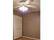 This bedroom includes a ceiling fan and closet with bi-fold doors at 26419 Rolling Acres E Dr, Brooksville, FL 34602