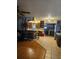 Open-concept kitchen featuring tile floors, dark wood cabinets, and rustic accents with views to the dining room at 26419 Rolling Acres E Dr, Brooksville, FL 34602