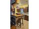 Kitchen features unique pendant lighting and breakfast bar with barstool seating at 26419 Rolling Acres E Dr, Brooksville, FL 34602