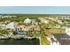 Aerial view featuring waterfront homes with private docks and boat lifts at 3006 Christophers Watch Ln, Ruskin, FL 33570