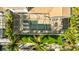 Aerial view of the property showing pool, lush landscaping, boat dock and screened in lanai at 3006 Christophers Watch Ln, Ruskin, FL 33570