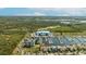 Waterfront property with private marina access, lush landscaping, and views of the estuary beyond at 3006 Christophers Watch Ln, Ruskin, FL 33570