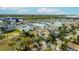Waterfront property featuring private marina access, lush landscaping, and views of the open water beyond at 3006 Christophers Watch Ln, Ruskin, FL 33570