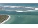 Scenic aerial view featuring sandbars and boats cruising on clear turquoise water near the shoreline at 3006 Christophers Watch Ln, Ruskin, FL 33570