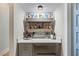 Chic bar area equipped with a beverage cooler, shelving, and ample counter space at 3006 Christophers Watch Ln, Ruskin, FL 33570