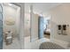 Luxurious bathroom showcasing a shower, toilet, and access to the main bedroom, with stylish decor at 3006 Christophers Watch Ln, Ruskin, FL 33570