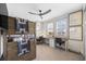 Bright bedroom featuring a ceiling fan, built-in desk with dual workstations, and motivational art prints at 3006 Christophers Watch Ln, Ruskin, FL 33570