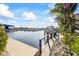 A boat is docked next to a well maintained yard in this waterfront community at 3006 Christophers Watch Ln, Ruskin, FL 33570