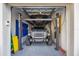 A 4-post lift maximizes parking space in this spotless garage at 3006 Christophers Watch Ln, Ruskin, FL 33570