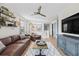 Spacious living area with stylish decor, balcony view, and comfortable seating at 3006 Christophers Watch Ln, Ruskin, FL 33570