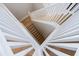 Modern staircase with white railings and wood steps at 3006 Christophers Watch Ln, Ruskin, FL 33570