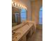 Bathroom features double sinks and large mirror and lighting at 3292 Dow Ln, Spring Hill, FL 34609