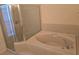 Bathroom showcasing a shower and a tub at 3292 Dow Ln, Spring Hill, FL 34609